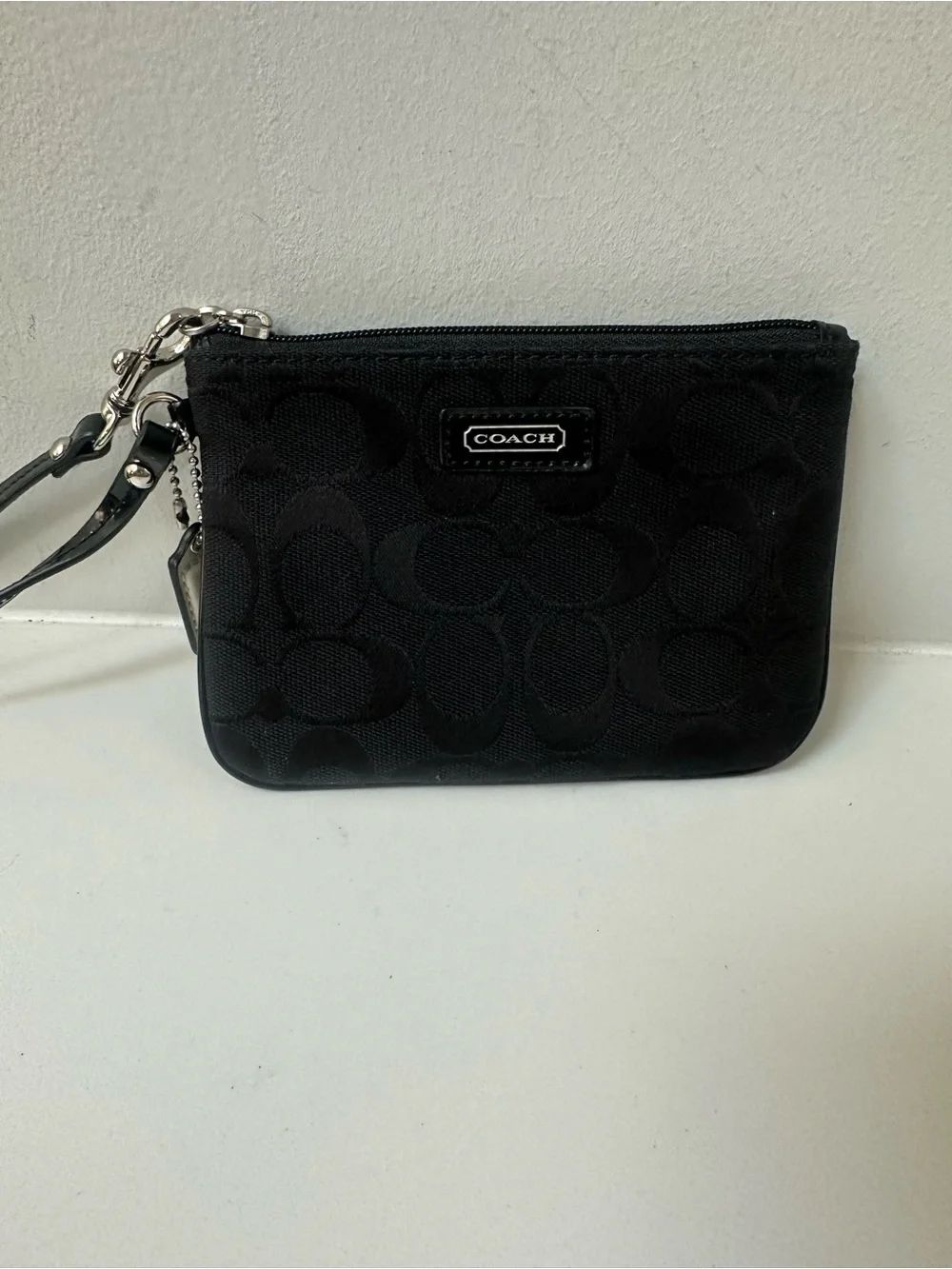 COACH Black Signature Wristlet with white coach tag